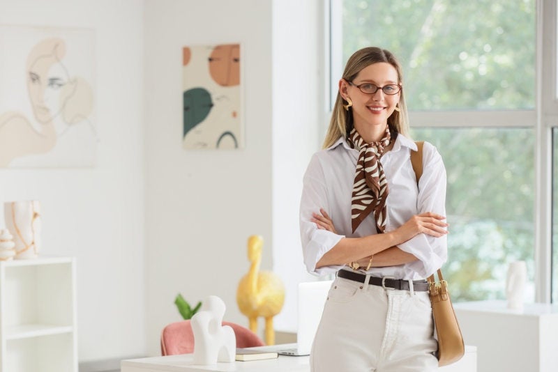 A young professional woman who enjoys helping people and is trying to decide if she should become a social worker or a licensed counselor
