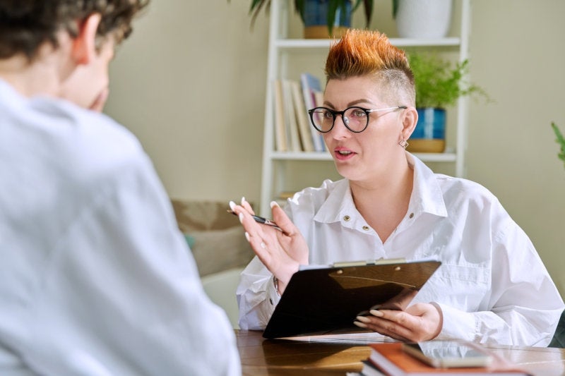 A clinical social worker consulting with a client in their independent practice.