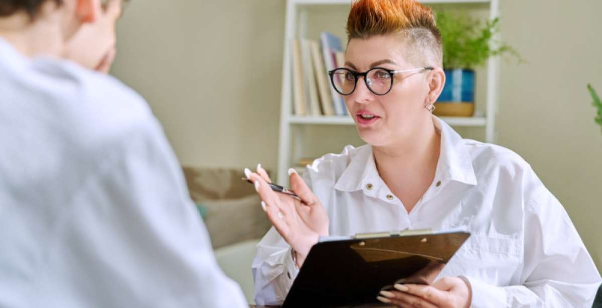 A clinical social worker consulting with a client in their independent practice.