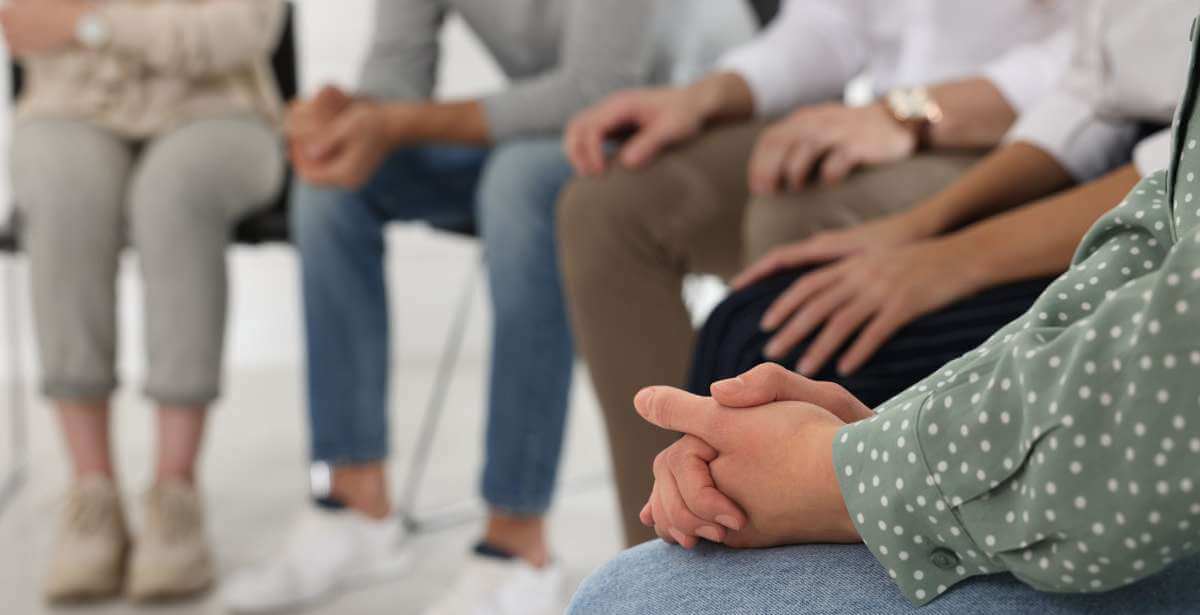 A substance use disorder group being run by a social worker
