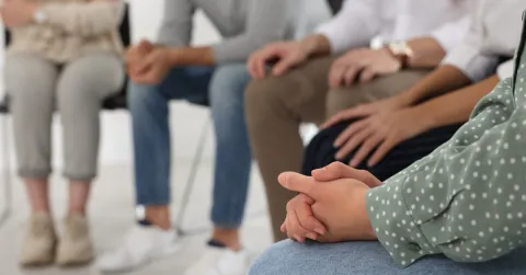 A substance use disorder group being run by a social worker